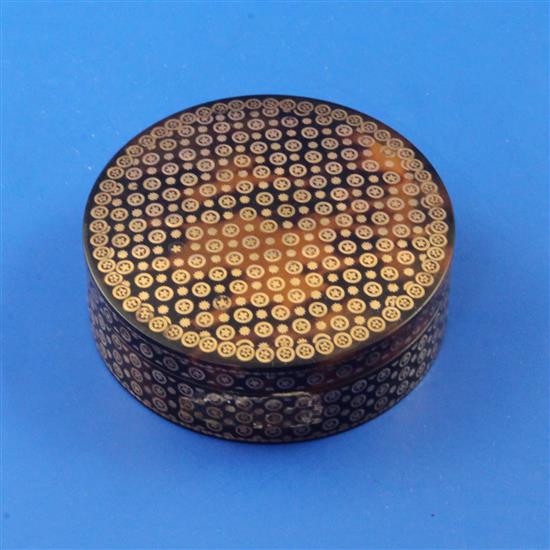 A late 19th/early 20th century tortoiseshell and gold pique circular box and cover, 2.5in.